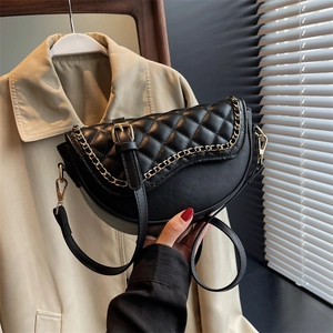Chic black quilted saddle bag with gold chain and adjustable strap for women