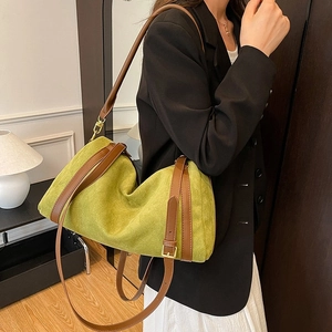 Mustard green faux suede tote bag with brown leather straps for daily commute use