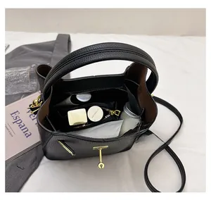 Top view of black pebbled leather bucket bag showing spacious interior capacity