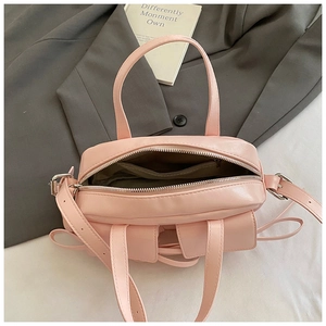 Internal view of the light pink tote bag showing smooth fabric lining and metal zipper pocket