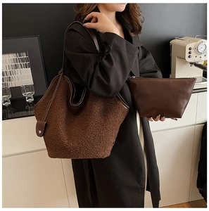 Detail of coffee brown fuzzy tote bag with leather straps and matching inner pouch