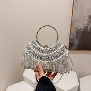 Silver evening clutch bag featuring pearl trim, rhinestone tassels and a metal ring handle