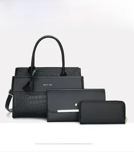 Detailed view of the 3-piece black snakeskin texture handbag set with wallets