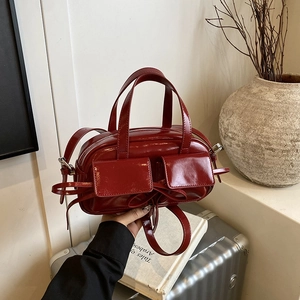 Fashionable burgundy high-gloss tote bag with front flap pockets and adjustable strap