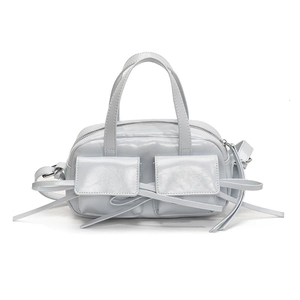 Chic light blue glossy handbag with front pockets and adjustable straps for women