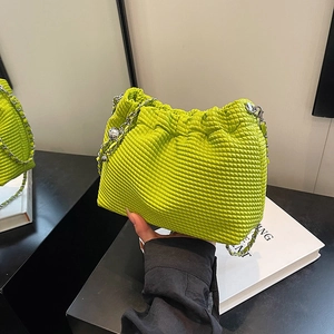 Green woven cloud bag with silver chain strap and drawstring closure for women