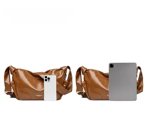 Brown leather tote bag size comparison with iPhone 15 Pro Max and iPad showing capacity