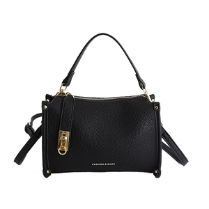 Minimalist black pebble leather square handbag with top handle and gold hardware