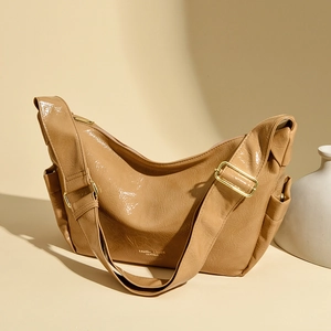 Chic khaki patent leather hobo bag with adjustable wide strap and gold hardware accents