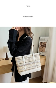 Detail of hand-woven straw tote with white leather handles and two-tone texture