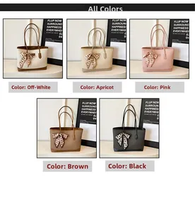 Close-up of five quilted tote bags in beige, pink, and black with elegant bow scarf charms