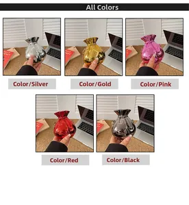 Detail view of stylish metallic drawstring pouch bags in five vibrant colors with chains