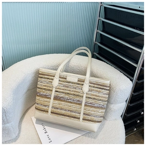 Close-up detail of the tri-color straw weave texture and premium faux leather handles