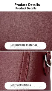 Détail du cuir grainé bordeaux avec des coutures durables et un anneau en D argenté