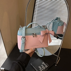 Pink and blue two-tone box handbag with litchi grain and a decorative bow charm