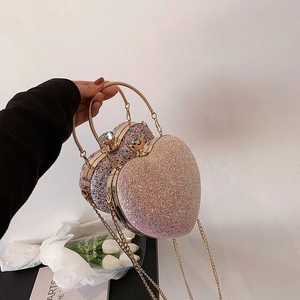 Detail of heart-shaped evening bags with glitter sequins and rhinestone clasp