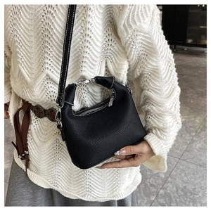 Litchi pattern leather bag with white contrast stitching and silver metal buckles