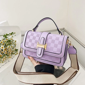 Lilac textured faux leather crossbody bag with chess pattern and wide fabric strap