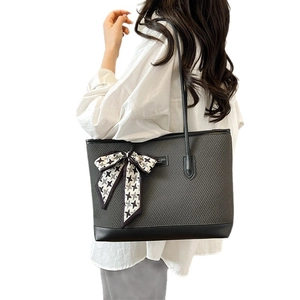 Minimalist grey quilted tote bag with silk scarf and large capacity for daily commute