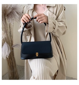 Minimalist black leather handbag featuring a vintage gold square buckle for women