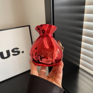 Metallic red purse shaped like a fortune bag with golden chain and sleek finish