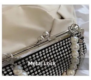Macro detail of high-quality hardware lock and elegant pearl handle on rhinestone evening bag