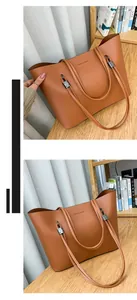 Detail view of a brown leather tote bag with Forever Young text on a wooden shelf