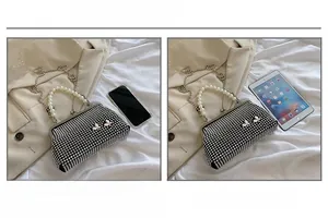Sparkly black evening bag size comparison with iPhone and iPad mini on satin backdrop