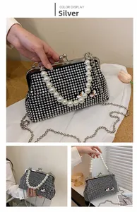 Silver evening clutch with rhinestone inlay, pearl handle and 3D butterfly detail