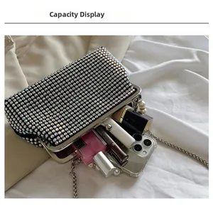 Capacity display of the rhinestone evening clutch showing phone and lipstick space