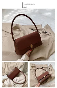 Close-up of vintage brown shoulder bag showing bronze twist lock and texture details
