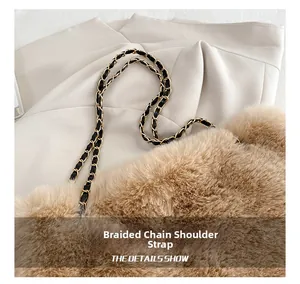 Detail of woven chain strap on a brown faux fur handbag with high-quality metal finish