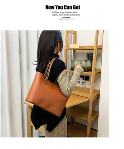 Caramel brown tote bag shown in a lifestyle setting, side view on model's shoulder