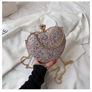 Elegant heart-shaped evening bag with colorful sequins and golden crystal clasp chain strap