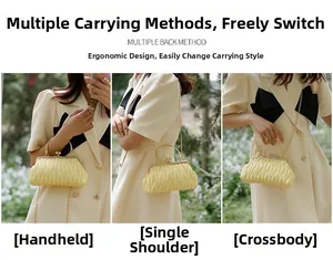 Three-way wear yellow pleated cloud bag with gold chain strap shown on a model