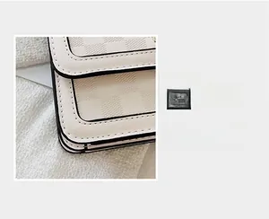 Close-up of off-white checkered handbag showing quality stitching and black edge paint