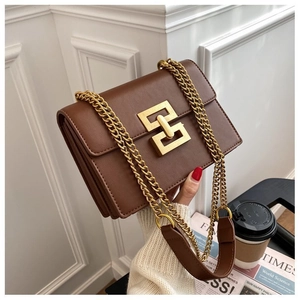 Brown faux leather chain shoulder bag featuring a geometric gold buckle and gusseted side