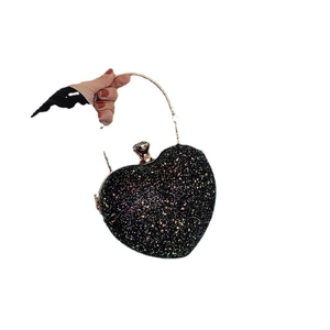 Elegant heart shaped black sequin evening clutch bag with round golden handle