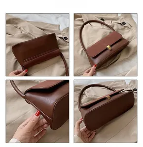 Detail view of brown leather shoulder bag showing metal clasp and stitching