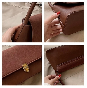 Detailed view of reddish brown handbag featuring leather stitching and retro metal buckle