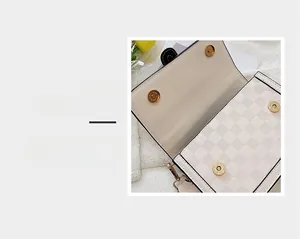 Detail of powerful magnetic clasp and checkerboard texture on cream synthetic leather bag