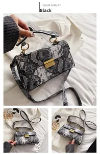 Detailed views of a black snakeskin pattern crossbody bag with gold metal hardware