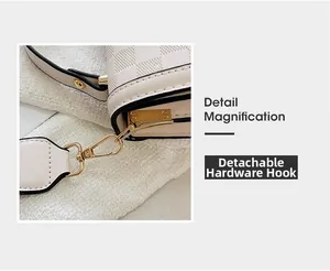 Detail view of the detachable gold-tone hardware hook on the cream checkered bag