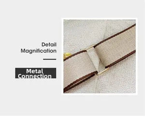 Detail magnification of durable gold-tone metal buckle and woven shoulder strap