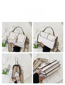 Detail view of small square crossbody bag with beige checkerboard pattern and gold buckle