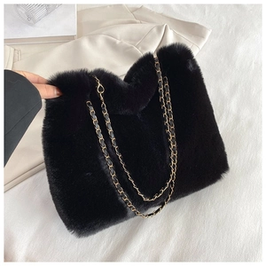 Chic black faux fur round tote bag with woven gold chain strap for autumn winter