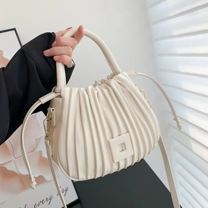 Chic white pleated bucket bag with top handle and adjustable shoulder strap for women