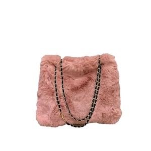 Chic pink faux fur crossbody bag with stylish metal chain strap for autumn winter fashion