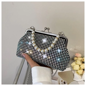 Detail of evening bag featuring colorful rhinestones, pearl handle and silver chain