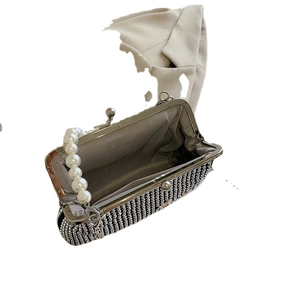 Luxury silver rhinestone evening bag with elegant pearl top handle and metal clasp